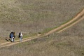 Paragliders hike to the launch point